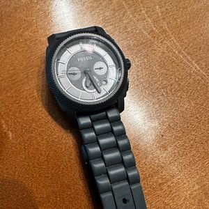 Fossils watch very nice. The band is rubber, and the actual watch is steel.